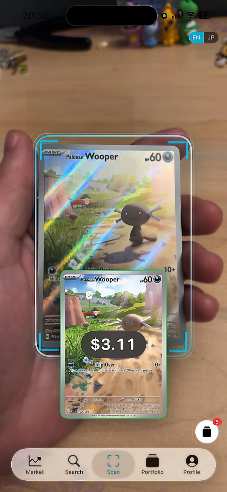 PopAlpha scanning a Paldean Wooper card and showing its $3.11 price